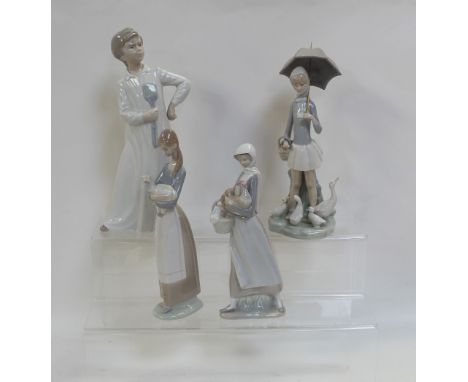 Three Lladró figures, a young girl with geese at her feet holding an umbrella, a young girl holding a lamb and one holding a 