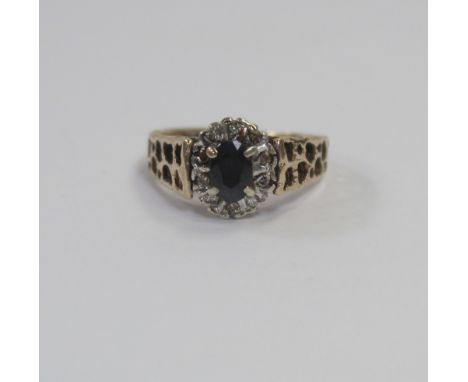 A 9ct gold sapphire and chip diamond cluster ring, size K, approx 3g.