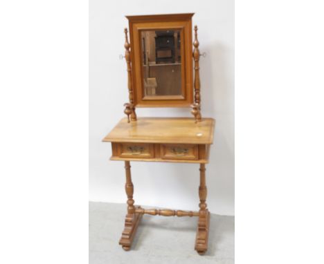 A mid/late 20th century oak dressing table with candle sconces and two frieze drawers on turned twin pillar base, height 142.