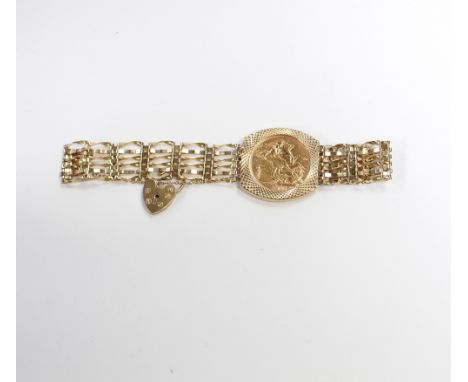 A George V full sovereign 1918 in a 9ct gold mount on a five bar gate bracelet, approx combined 15.9g.