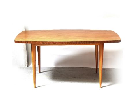 A 1960s faux wood melamine veneered kitchen table on oval tapering legs, length 150cm.