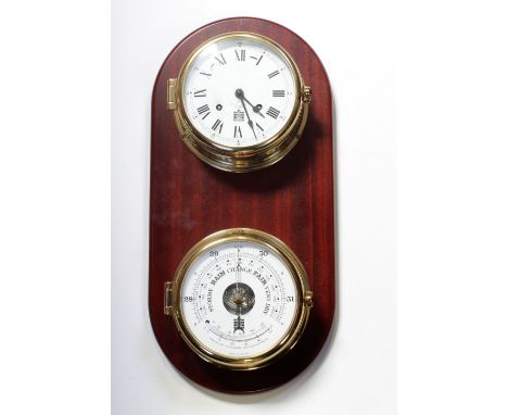 A Sewill's of Liverpool small brass ship's clock the white dial set with Roman numerals and a Sewill's barometer, both mounte