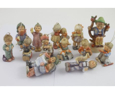 A collection of twelve Studio Hummel Goebel Christmas decorations, with certificated of authenticity and an extra Goebel figu