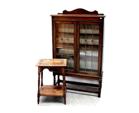 An Edwardian oak floor-standing bookcase with twin leaded doors on barleytwist frame base, height 143.5cm and an oak rectangu