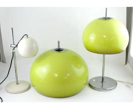 Three 20th century lamps and shades to include a chrome-based table lamp with acid green plastic shade, a larger matching lam