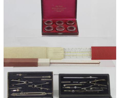 A small group of geometry apparatus including a speed-time-distance slide rule, an Aristo Scale rule in original plastic case