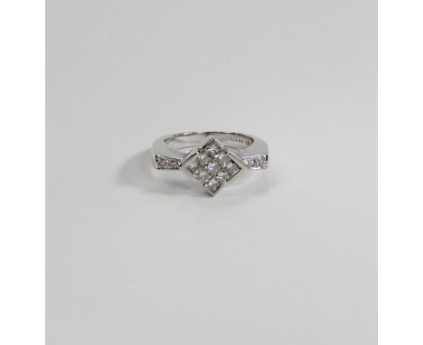 A modern 18ct white gold diamond cluster ring, the central table with approx 1ct of diamonds, size N1/2, approx 7.5g.