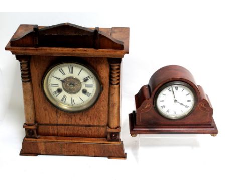 A Victorian walnut architectural mantel clock with twin-train movement striking on coiled rod, the dial set with Roman numera