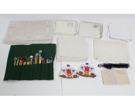 A small quantity of table linen to include open work, embroidered and crochet work, a large quantity of cotton lace trims and