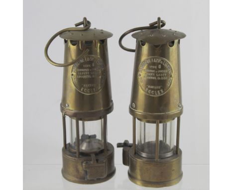 A pair of Protector miners' lamps Type 6, made in Eccles by the Protector Lamp &amp; Lighting Co Ltd, height of each 25cm (2)