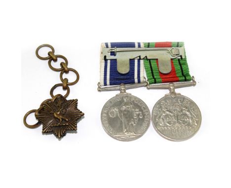 A WWII Defence Medal and a Police Service Medal to Sergeant Edward Howard and an epaulette badge on chain (3).