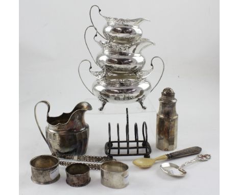 A small group of 18th century and later silver items to include an Irish helmet-shaped silver milk jug in the Neo-Classical s