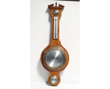 A mahogany mid/late 20th century aneroid barometer/thermometer with broken Classical pediment, height 58cm.
