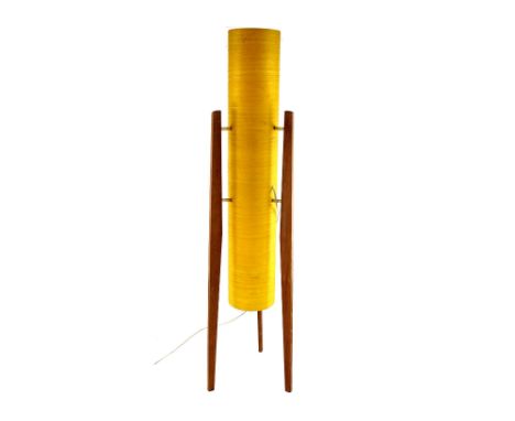 A 1970s teak rocket lamp with yellow cylindrical shade, height 94cm.