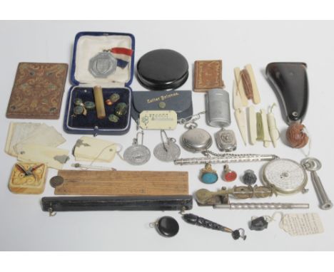 A mixed lot to include a set of brass sovereign scales, a 1930s ivory aide-mémoire, a tooled leather calling card case, a pap