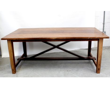 A 20th century walnut refectory-style table, the plank top supported on X-frame base, length 200cm.