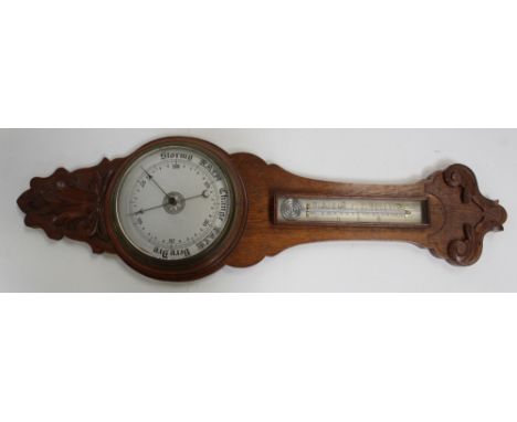 A mid-20th century oak wall hanging barometer with silvered dial, length 91cm.