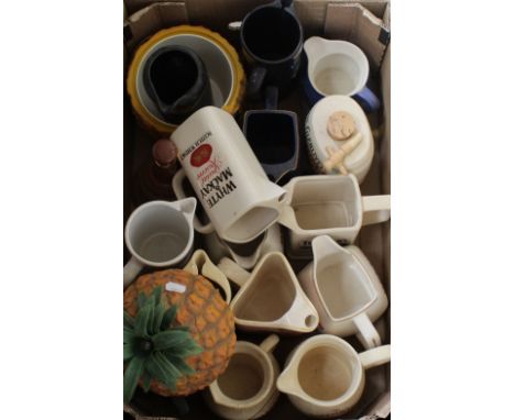 A good selection of vintage whisky and vodka water jugs and a Britvic ice bucket in the shape of a pineapple.