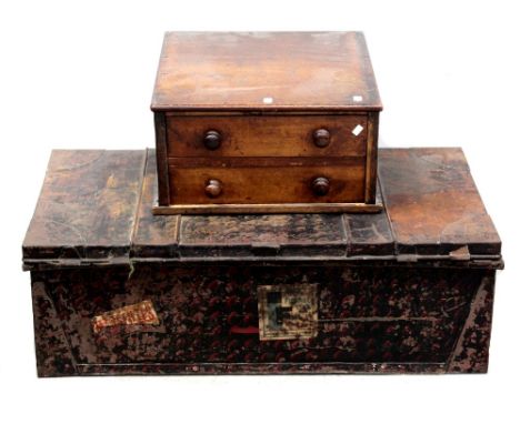 An early 20th century tin uniform trunk with travel labels for 'Blue Funnel Line' travelling to South Africa, Australia and t