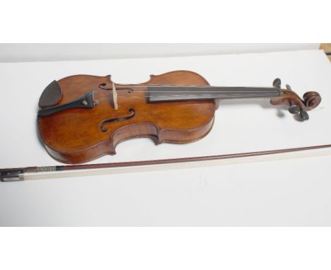 A late 19th century violin with 14.5 inch two-piece back and paper label to the interior marked 'Antonius Stradivarius 1726' 