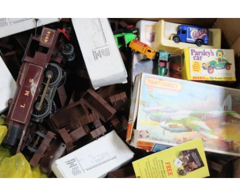A collection of diecast models, model kits and a maroon livery LMS O gauge locomotive.