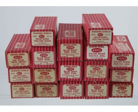 A collection of Hornby Dublo model railways rolling stock to include four 4657 United Dairies Milk Tank Wagons, three 4679 Ta