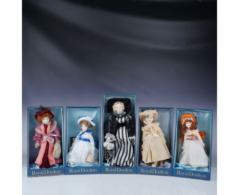 This lot features five collectible Royal Doulton Nisbett dolls, all with their original packaging, though two do not have the