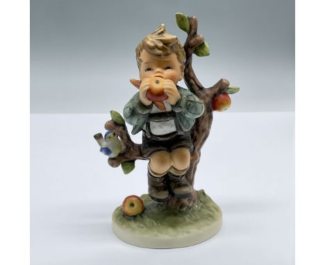 A darling porcelain figure of a boy sitting on an apple tree, eating an apple, while a blue bird chirps beside him. Marked Go