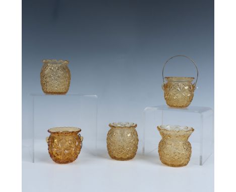 A delightful set of five round yellow art glass toothpick holders features mesmerizing kaleidoscope like patterns on their su