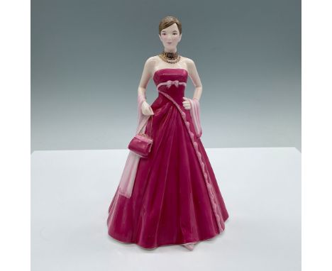 A beautiful, elegant woman wears a flowing long pink dress paired with a matching handbag, a delicate light pink sash draped 