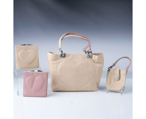 A sophisticated collection of 4 Brighton leather accessories in neutral tones with pink accents. This set includes: a soft be