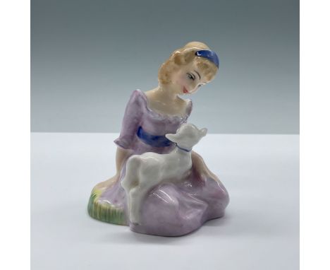 Mary, dressed in a soft purple dress with an indigo sash and matching headband. Her lamb rests gently on her legs and they ga