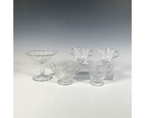A dazzling glass collection featuring a compote, two sugar bowls, and two creamers, each adorned with an intricate botanical 
