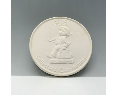 Vintage home decor depicting a young boy holding an umbrella and a travel bag. Goebel backstamp. This item has its original b