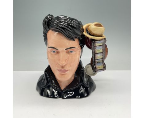 This Royal Doulton large character jug, titled Elvis Stand Up, celebrates the iconic singer Elvis Presley. Crafted with intri
