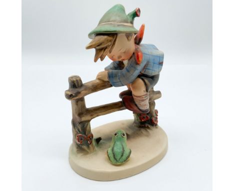 This delightful Goebel porcelain figurine, titled "Retreat to Safety," stands 6Ã¢â‚¬ÂH and features a young boy perched on a 