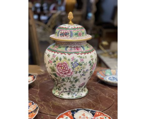 A FRENCH FAMILLE ROSE STYLE HAND PAINTED VASE AND COVERthe urn of baluster form, with domed cover with ormolu fruiting finial