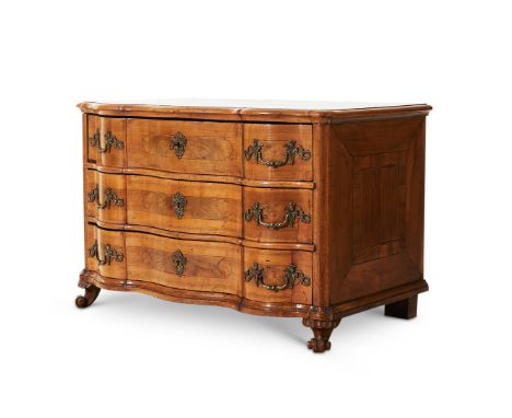 AN 18TH CENTURY ITALIAN WALNUT SERPENTINE CHEST OF DRAWERSthe commode with gilt brass handles decorated with baroque style te