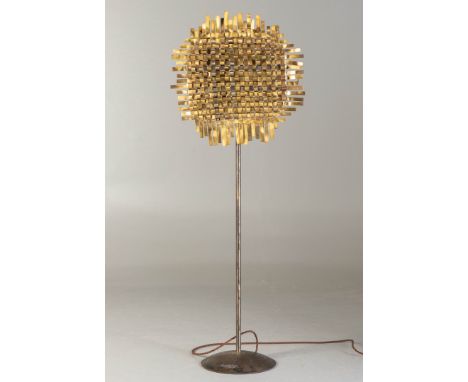 A 1960'S BRUTALIST STYLE METAL FLOOR STANDING LAMPthe main shade formed from intertwined strips of metal, giving a sunflower 