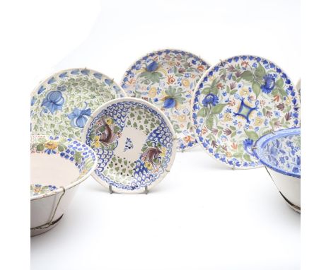 A COLLECTION OF FIVE SPANISH PAINTED PLATESthe hand painted ceramic dishes decorated in blue, green, ochre and yellow with st