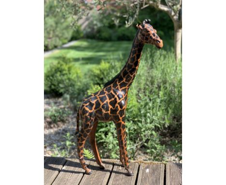 A PAINTED LEATHER MODEL OF A GIRAFFEin the style of Dimitri Omersa,70cm high