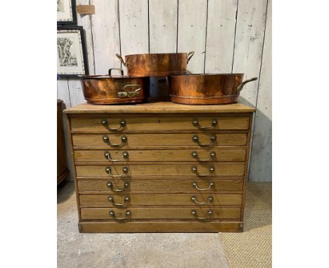 A 19TH CENTURY PINE PLAN CHESTthe chest of narrow drawers with brass ring handles,