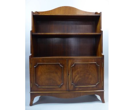 A Reproduction Mahogany Waterfall Bookcase with Panelled Doors to Cupboard Base and Bracket Feet. 85 x 27 x 121cms High 