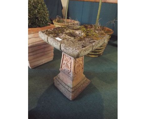 A Reconstituted Stone Tree Trunk Bird Bath, 59 cms high