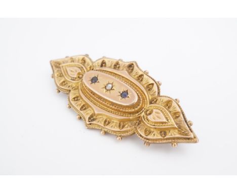A Victorian yellow metal, pearl and blue stone locket brooch of Etruscan influenced form, marked 9 ct, 5.5 cm. 5 g