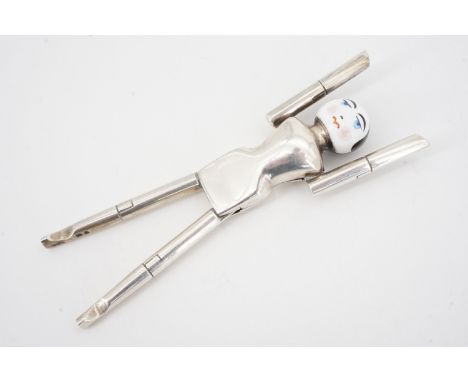 A set of 1920s novelty Dutch doll silver and enamel sugar tongs, Cohen &amp; Charles, London, 1922, 12 cm