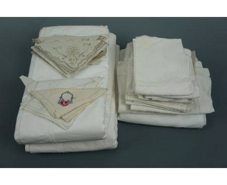 A quantity of antique and vintage whitework table linens, tea tray liners and napkins