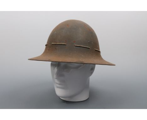 Two Second World War Fire Guards' steel helmets and a US M1 helmet liner