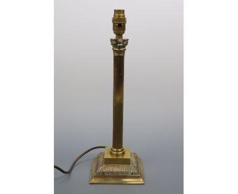 A brass columnar table lamp base, 40 cm high