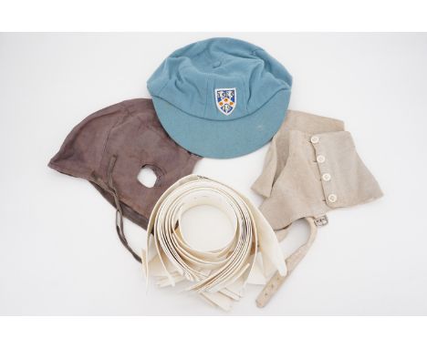 A vintage school cap, shirt collars, spats and a sporting cap